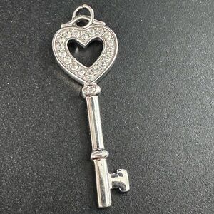 17A- 925 Sterling Silver Heart Key Pendant with clear stones. Not tested.